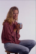 657009 Model Holding Coffee Cup, Sitting On Stool A4 Photo Print