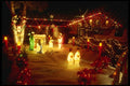 658053 Christmas Lights Sparkle On House At Christmas A4 Photo Print