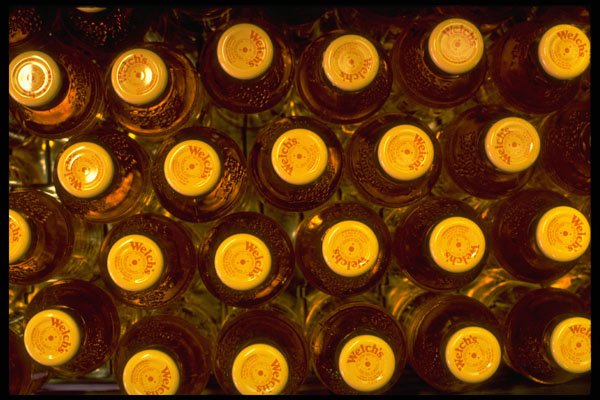 662047 Overhead View Of Grape Juice Bottles A4 Photo Print