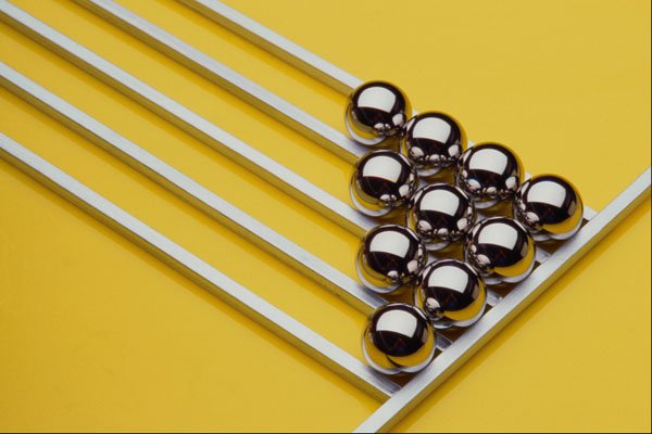 662057 Steel Balls And Rods On Yellow Acrylic A4 Photo Print