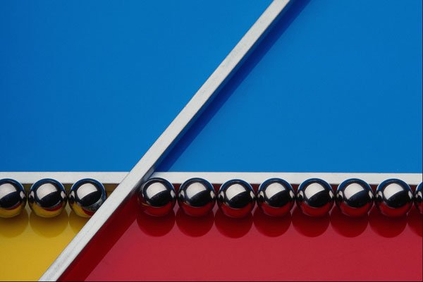662058 Steel Balls And Rods On Multicolored Acrylic A4 Photo Print