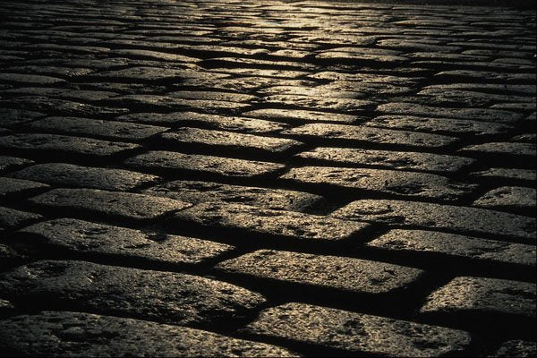 662086 Backlit Cobbled Street A4 Photo Print