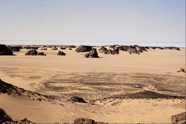 664013 Surreal Shapes In Sandstone With Land Rover, Algeria A4 Photo Print