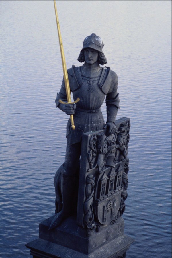 666031 Statue At The Foot Of Charles Bridge, Prague, Czech Republic A4 Photo Print
