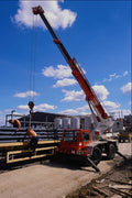 667057 Mobile Crane Unloads A Truck At A Building Site, England A4 Photo Print