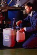 667071 Pumping Machine Oil Into Small Container A4 Photo Print