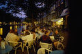 673013 Sidewalk Cafes Line Every Canal In Amsterdam A4 Photo Print