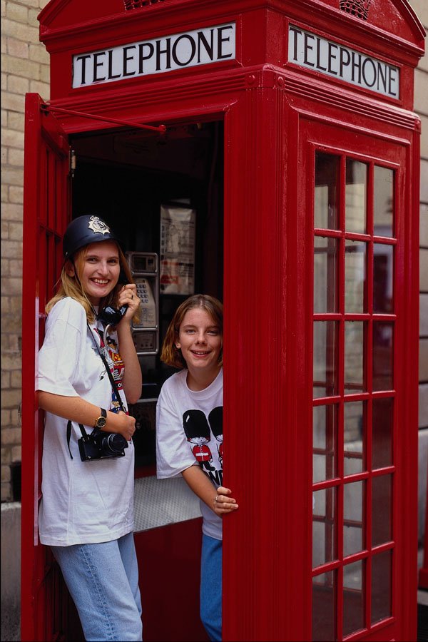 673030 Young Girls At Old Style Telephone Booth, London, England A4 Photo Print