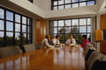 673055 Executives Around Conference Table A4 Photo Print