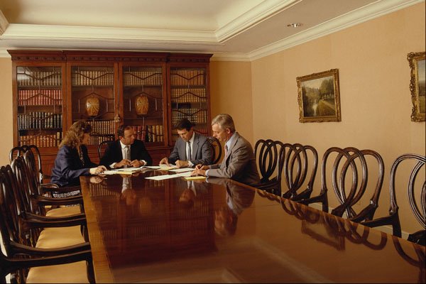 673063 Executives In Conference Room Having A Meeting A4 Photo Print