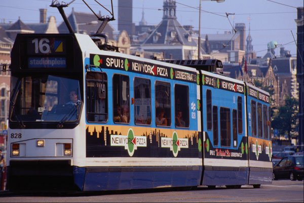 673074 Many Amsterdam Trams Are Decorated With Advertisements A4 Photo Print