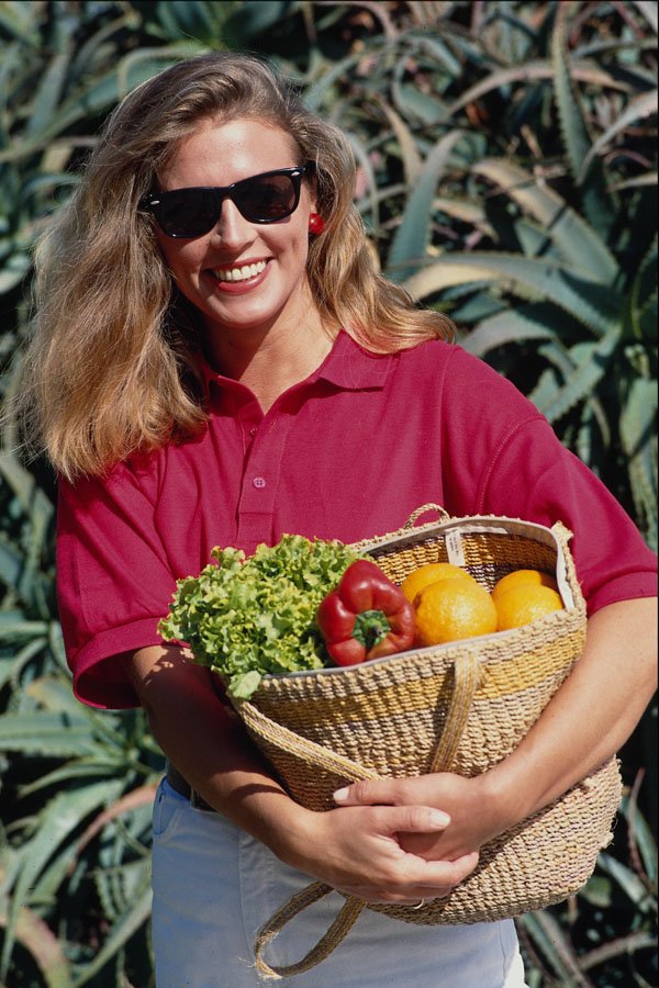 673094 Shopper With Sunglasses Holding Basket Of Fruit A4 Photo Print