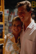 673095 Happy Couple Looking At Holiday Postcards A4 Photo Print