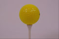 674029 Yellow Golf Ball And Tee A4 Photo Print