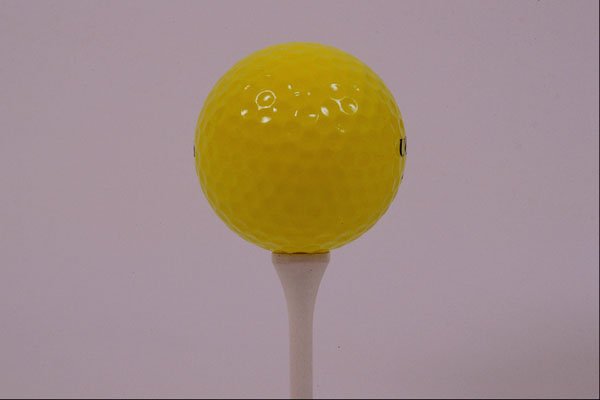 674029 Yellow Golf Ball And Tee A4 Photo Print