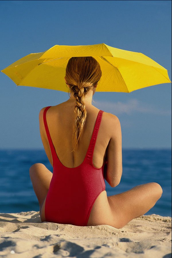 674098 Blonde On The Beach With A Yellow Umbrella A4 Photo Print