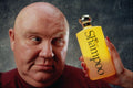 677061 Bald Man Looking At Shampoo Bottle A4 Photo Print