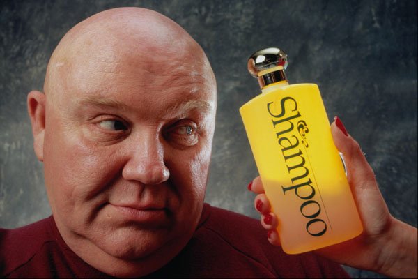 677061 Bald Man Looking At Shampoo Bottle A4 Photo Print