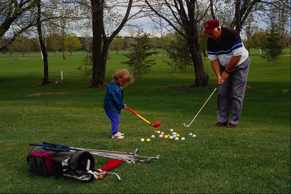 681069 Grandpa Gives A Golf Lesson A4 Photo Print