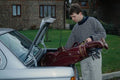 681095 Man Loading Golf Clubs Into Car A4 Photo Print