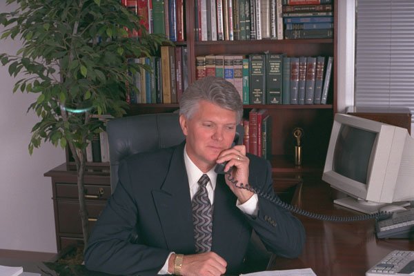 682041 Professional Man Sitting At Executive Desk A4 Photo Print