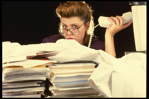 682066 Businesswoman With Stacks Of Paperwork A4 Photo Print