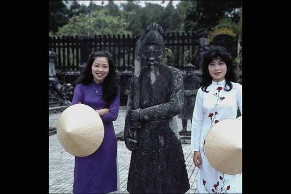 685077 Models In Traditional Ao Dai Pose With A Military Mandarin A4 Photo Print