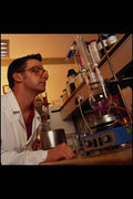 686047 Scientist Monitoring Chemical Synthesis Step, Research Lab A4 Photo Print