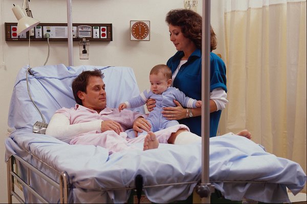 686050 Family Visiting Patient In Hospital A4 Photo Print
