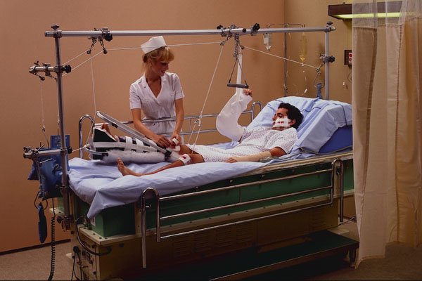 686051 Nurse Treating Badly Injured Patient A4 Photo Print