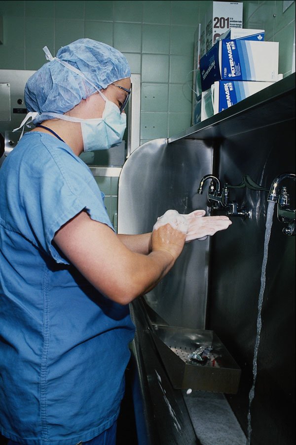 686059 Nurse Scrubbing For Operating Room A4 Photo Print
