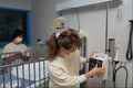 686062 Nurses Preparing Intravenous A4 Photo Print