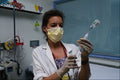 686069 Nurse Preparing Needle For Injection A4 Photo Print
