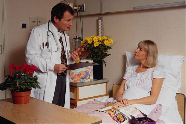 686083 Doctor Talking To Patient A4 Photo Print