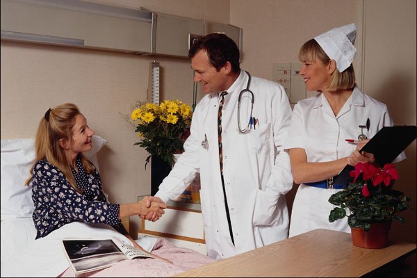 686084 Doctor Meeting Patient With Nurse In Attendance A4 Photo Print