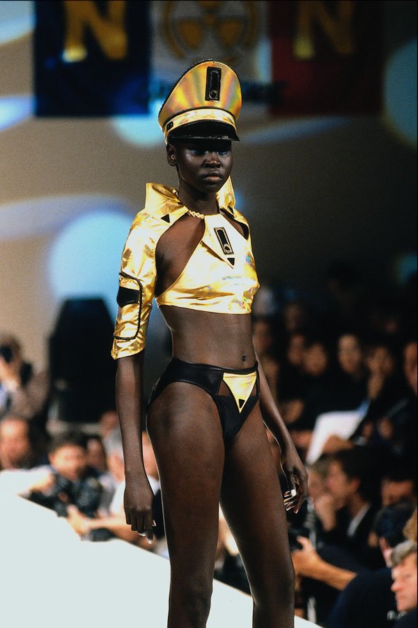 688051 Female Wearing Gold Hat And Top With Leather Bikini A4 Photo Print
