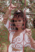 688062 Girl In White Through Red Iron Gate A4 Photo Print