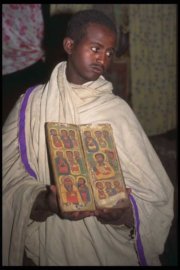 696038 Priest With Ancient Book At Acheton Mariam A4 Photo Print