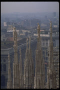 698052 A View Of The Statues Atop The Duomo Overlooking Milan A4 Photo Print