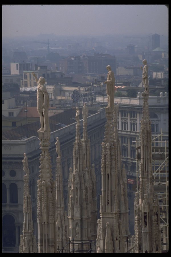 698052 A View Of The Statues Atop The Duomo Overlooking Milan A4 Photo Print