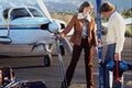 702009 Couple With Skies And Plane A4 Photo Print