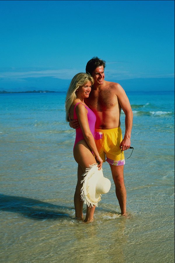 702014 Couple Standing In Sea, Playa Blanca, Lanzarote, Spain A4 Photo Print