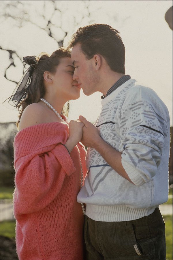 702068 Young Couple Kissing In Park A4 Photo Print