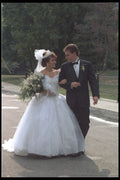 702082 Bride And Groom Walking In A Park A4 Photo Print