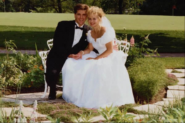 702093 Bride And Groom Sitting In A Garden A4 Photo Print