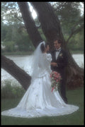 702095 Bride And Groom Holding Hands In Front Of Water A4 Photo Print