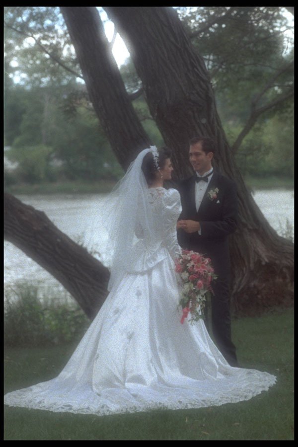 702095 Bride And Groom Holding Hands In Front Of Water A4 Photo Print