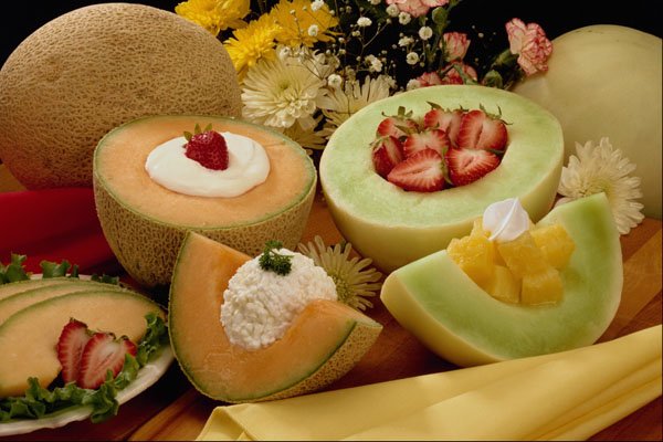 710053 Cantaloupes And Melons On Cutting Board With Flowers A4 Photo Print