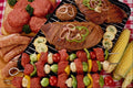 710060 Barbecue With Uncooked And Cooked Meat On The Grill A4 Photo Print