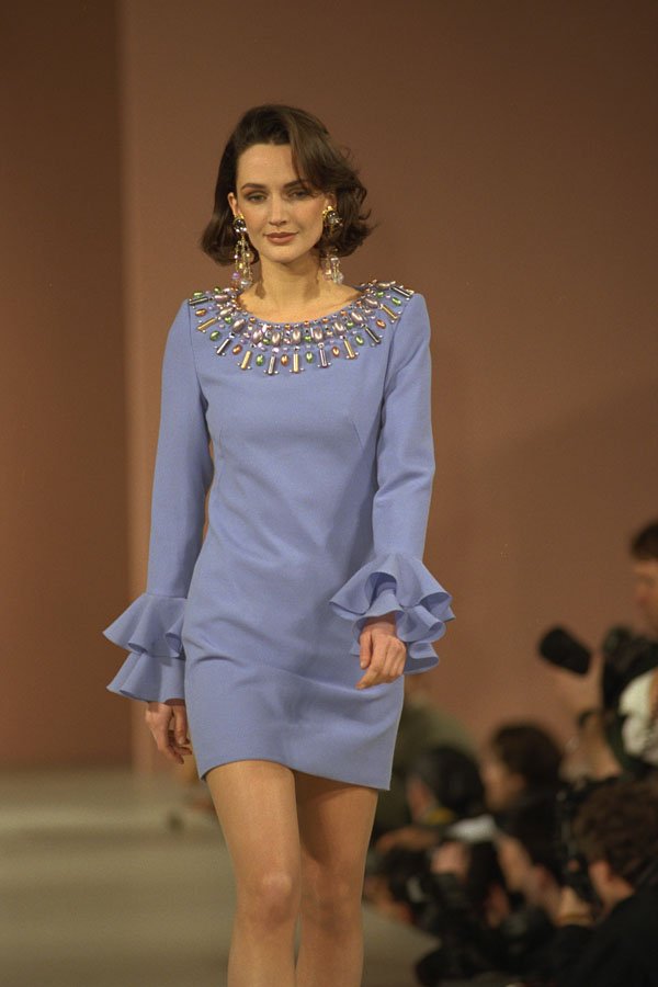 712029 Woman Wearing Violet Mini Dress With Large Beaded Collar A4 Photo Print